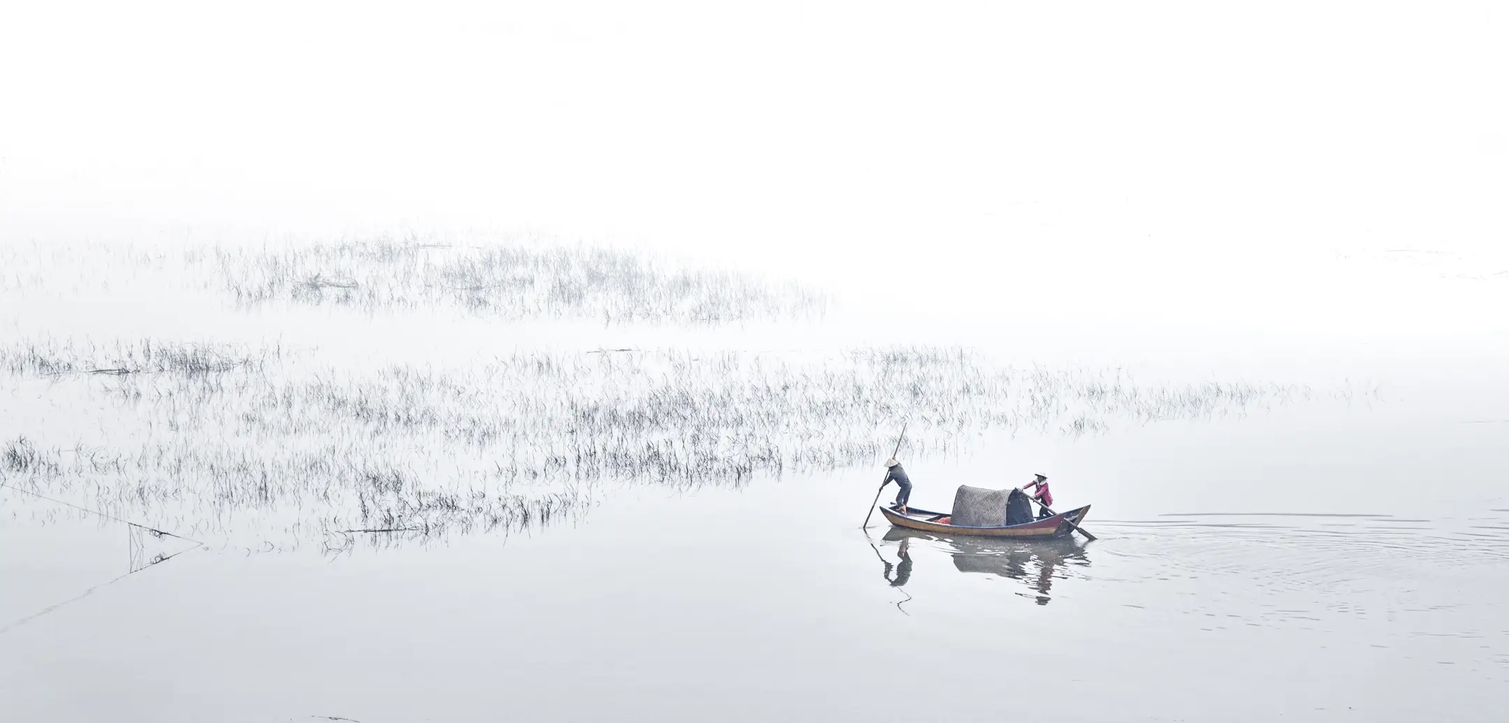 Fishermen on misty Xiapu waters at dawn