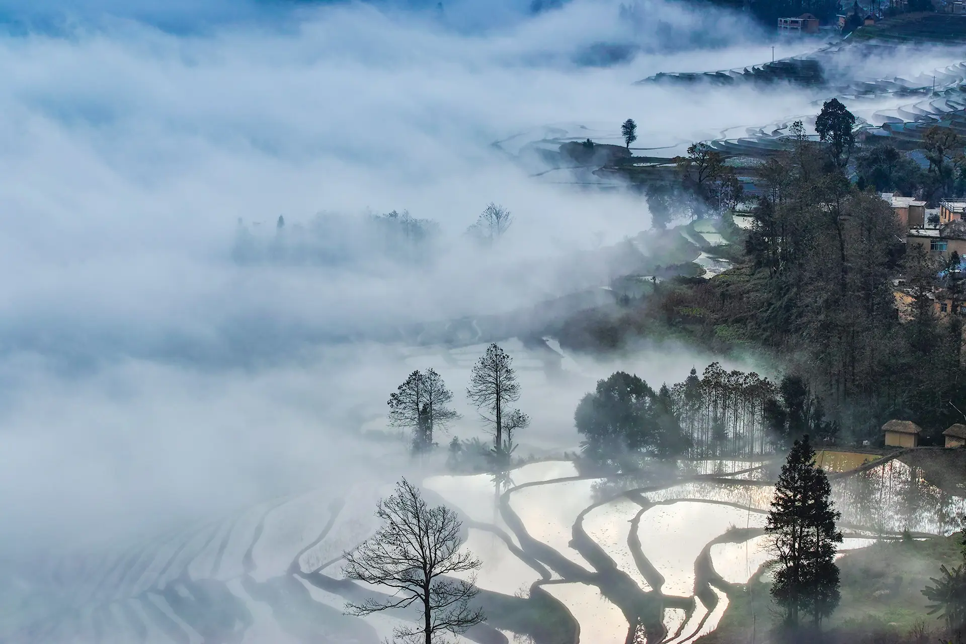 Sea of mist over Yuan Yang village and terraces